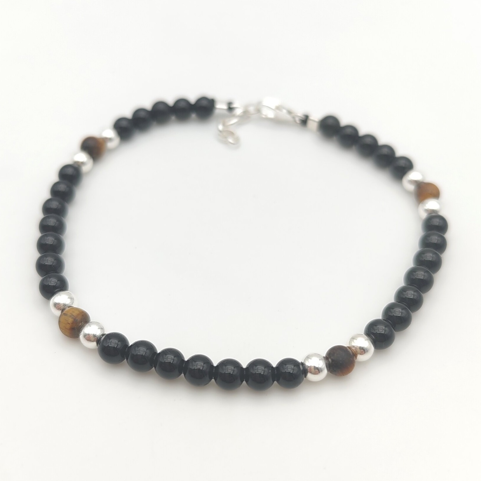 Bracelet de protection pour homme en perles de 4 mm dobsidienne noire et œil de tigre, avec finitions et fermoir en argent 925.