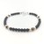 Vue détaillée du bracelet artisanal pour homme mêlant obsidienne, œil de tigre et perles en argent massif.
