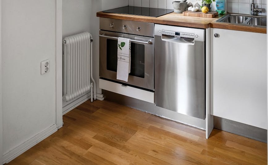 sleek minimalist kitchen with stainless steel appliances and open shelving ideal for modern interiors
