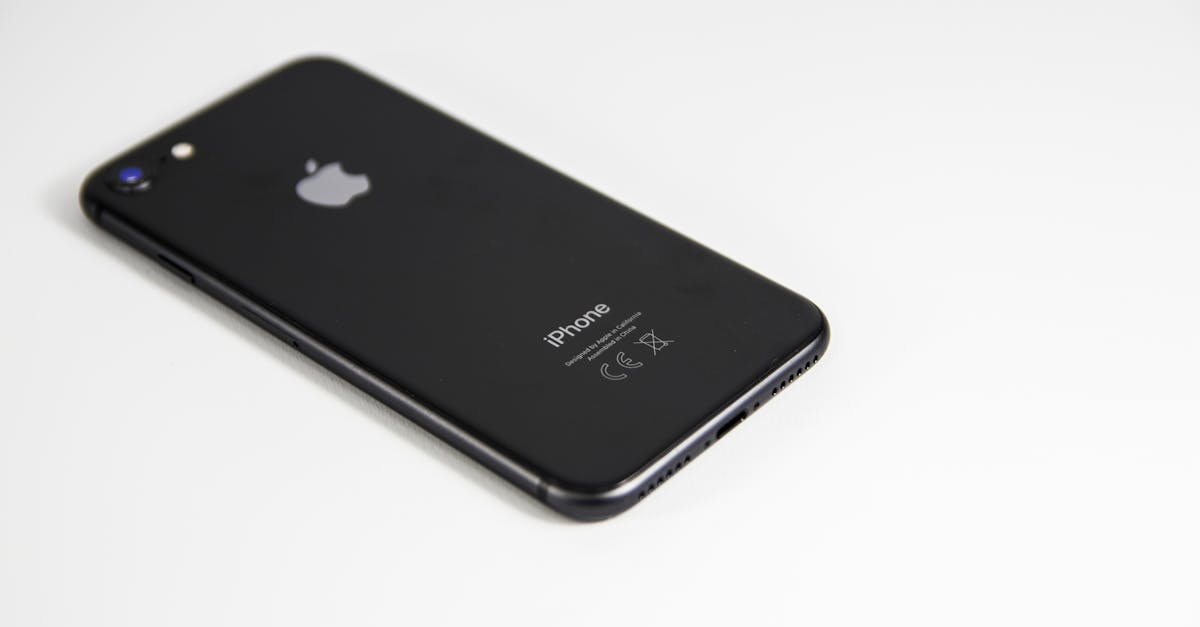 black smartphone placed on a clean white surface highlighting modern design and tech elegance