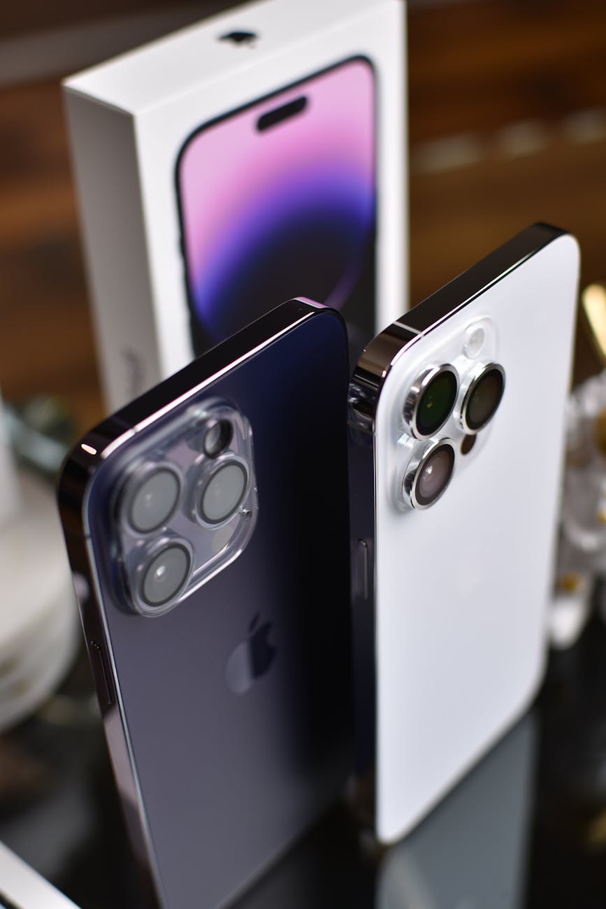 close up of iphone 14 pro max in white and black highlighting camera features