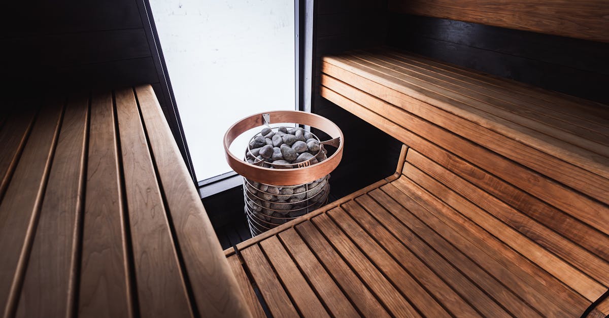 elegant nordic sauna interior featuring wooden benches and modern sauna heater