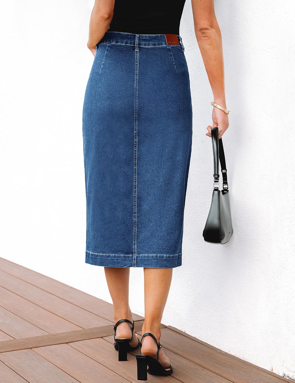 Denim midi skirt front view with utility pockets