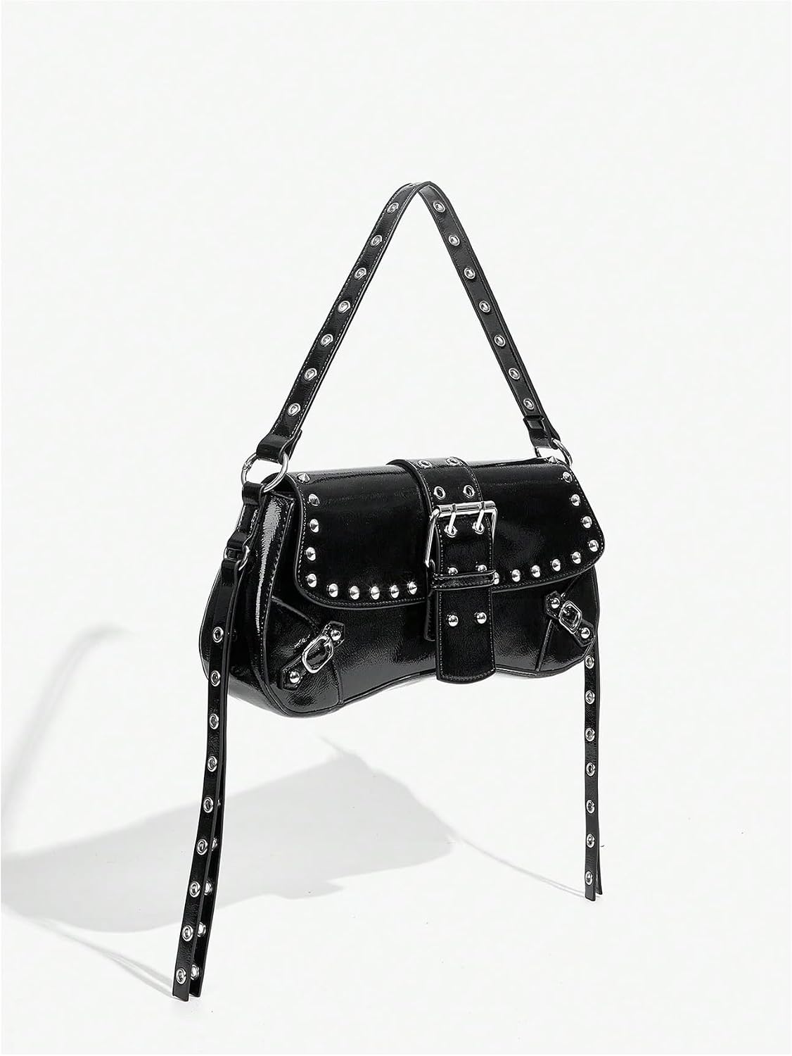 Studded shoulder bag carried by the top handle