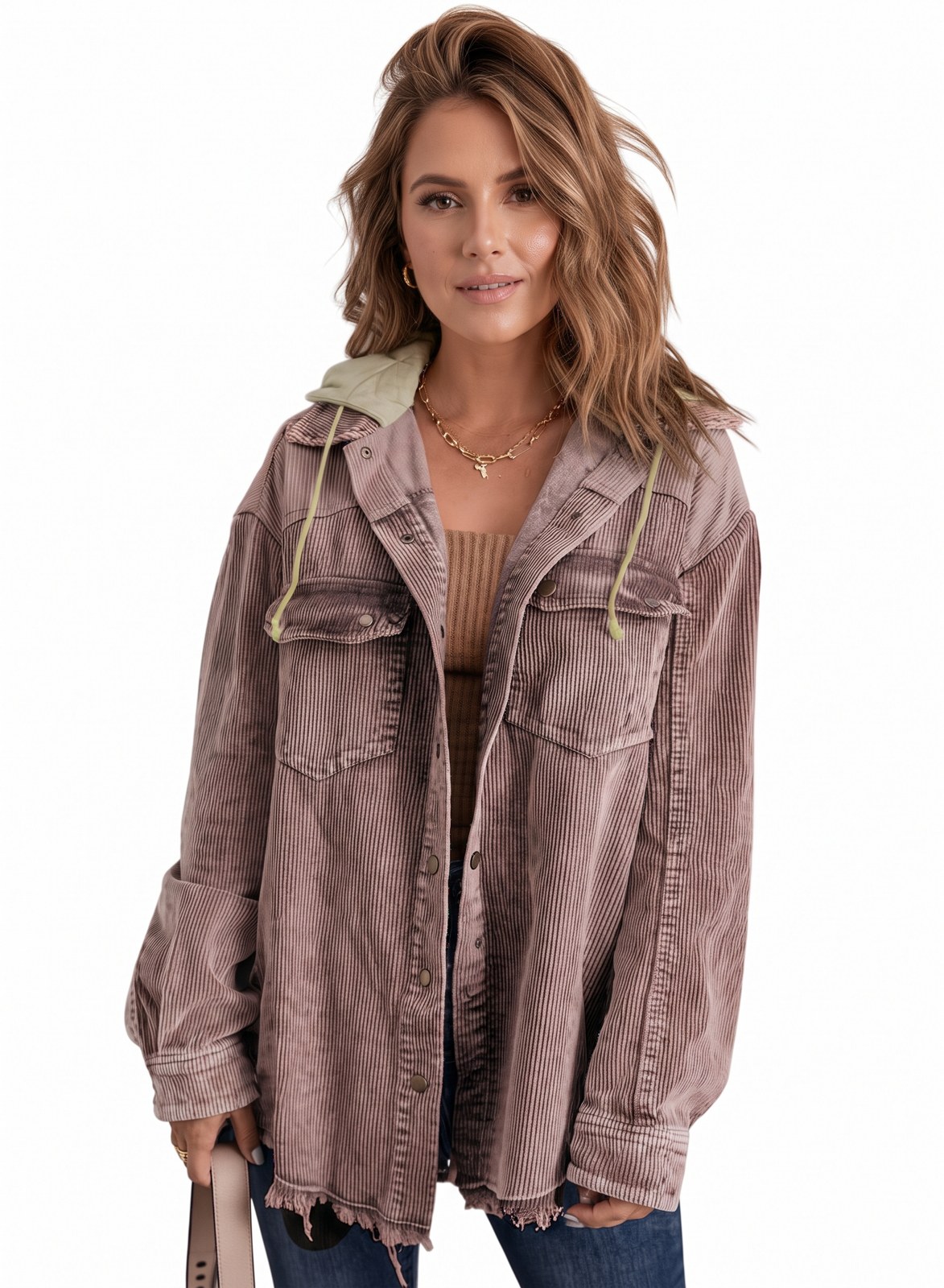 Woman wearing a hooded corduroy shacket in dusty mauve