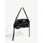 Studded shoulder bag carried by the top handle