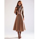 Woman wearing a long camel double-breasted wool coat with a gray scarf