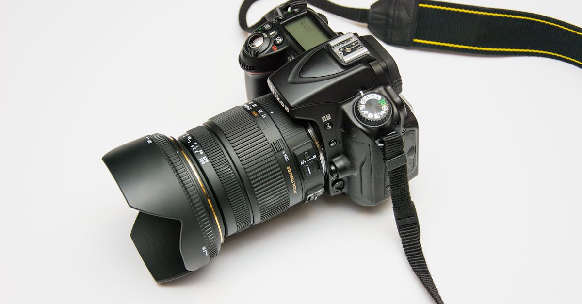 close up of a dslr camera with a lens and strap ideal for photography equipment themes