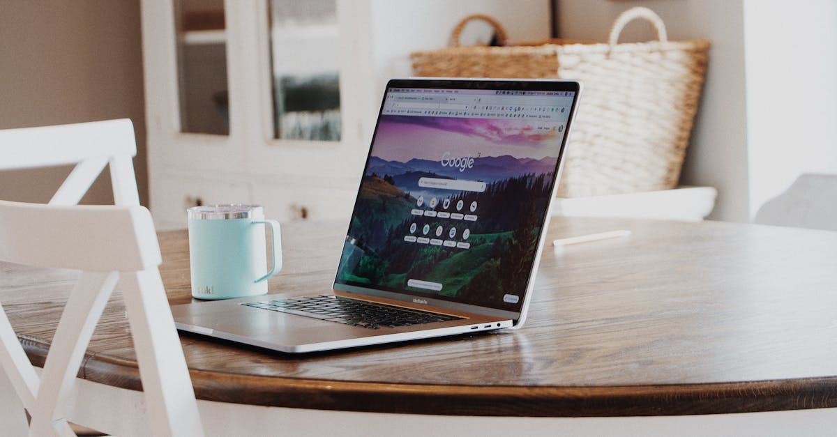 a sleek laptop on a wooden table with a mug exemplifying a modern home workspace