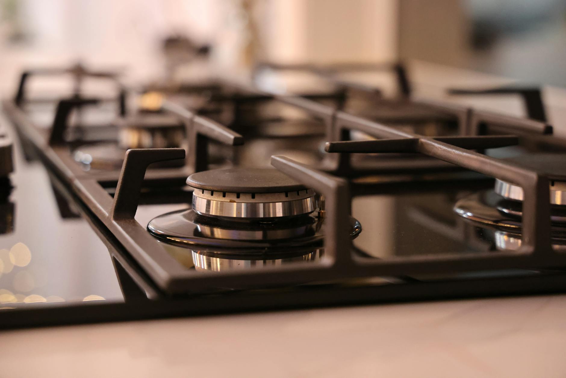 close up of a modern stainless steel gas stove top ideal for contemporary kitchens and cooking environments