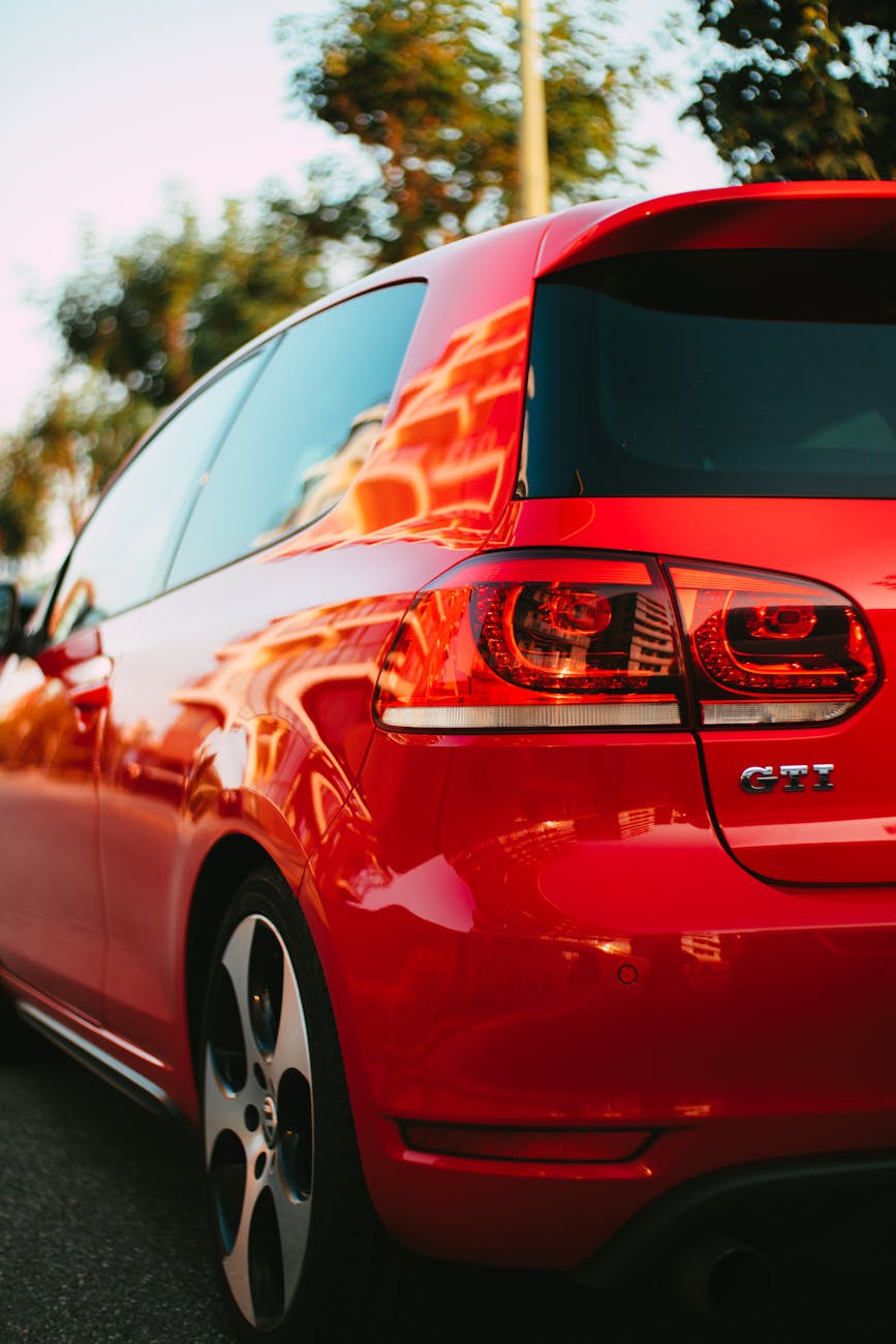 a striking close up of a red volkswagen golf gti sports car with modern design and sleek curves