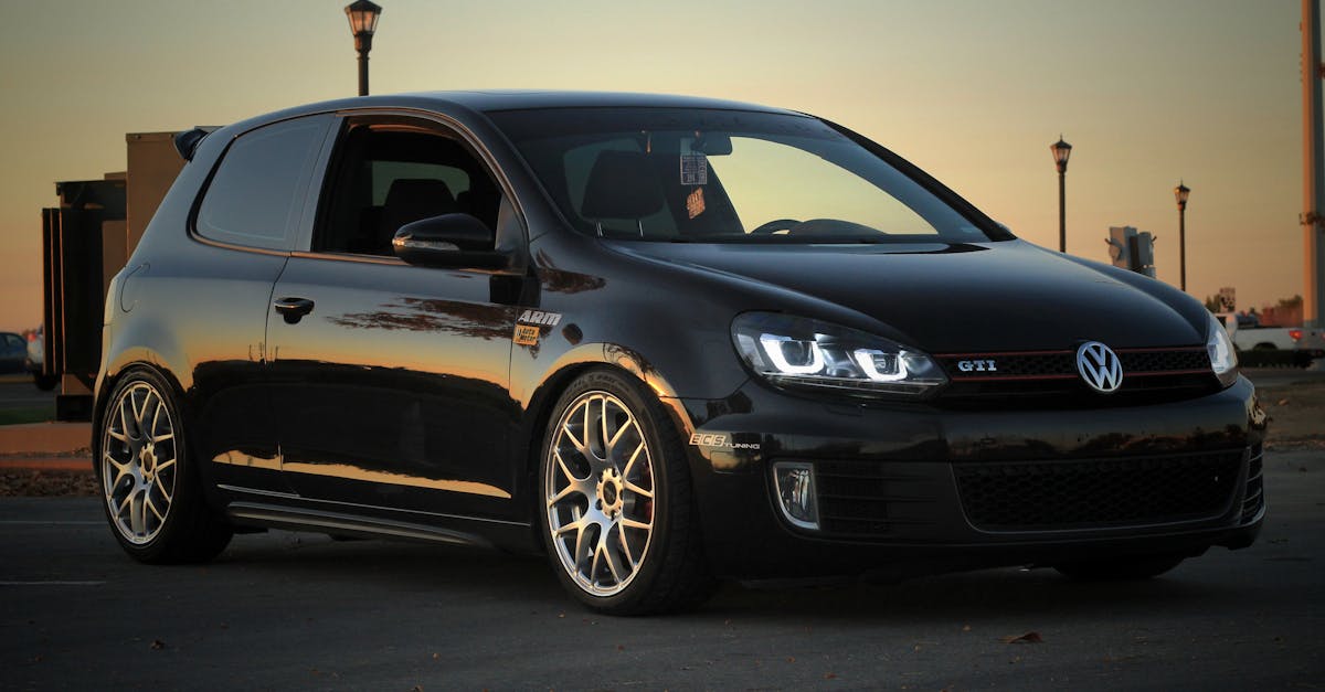 a stylish volkswagen golf gti parked at sunset showcasing modern design and elegance