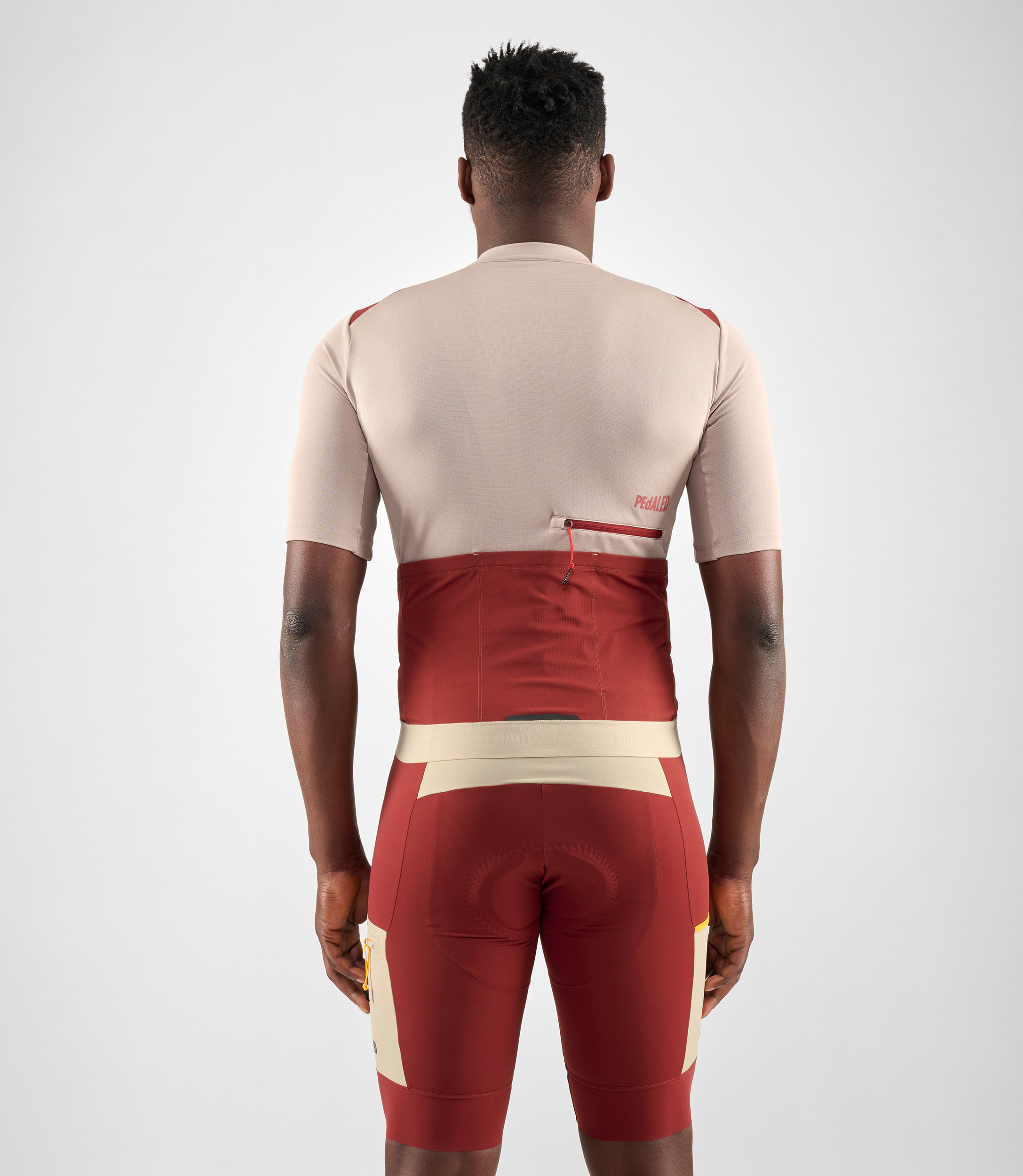 men-cycling-merino-jersey-beige-odyssey-total-body-back-pedaled