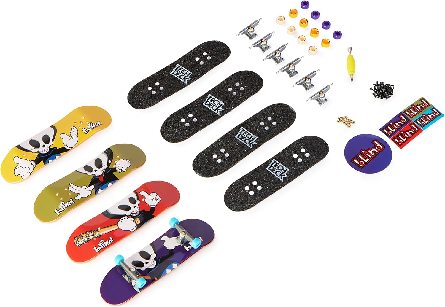 Contenu dun pack Blind étalé : quatre planches illustrées, grips, trucks, roues et outil