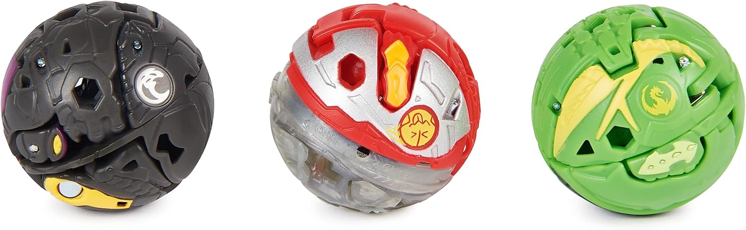 Les trois Bakugan refermés en boule : Hammerhead noir, Dragonoid rouge et Nillious vert