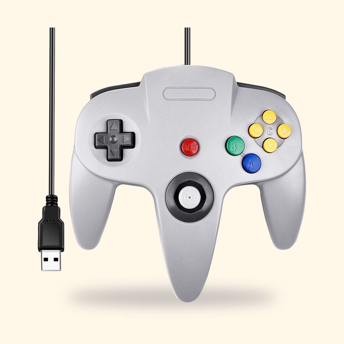 Manette N64 USB miadore grise avec son câble, sur fond crème