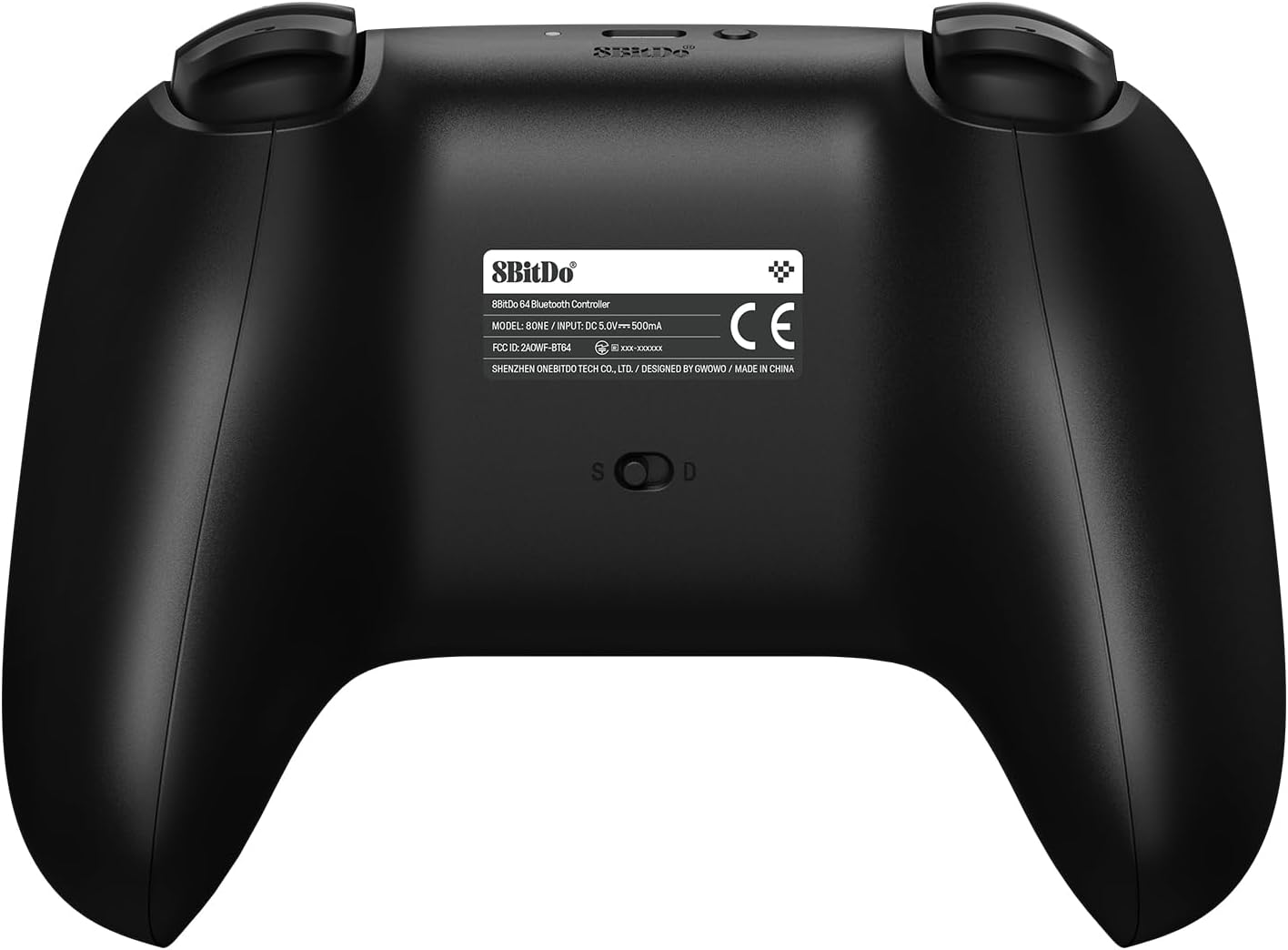 Dos de la manette 8BitDo 64 avec son étiquette et son sélecteur de mode