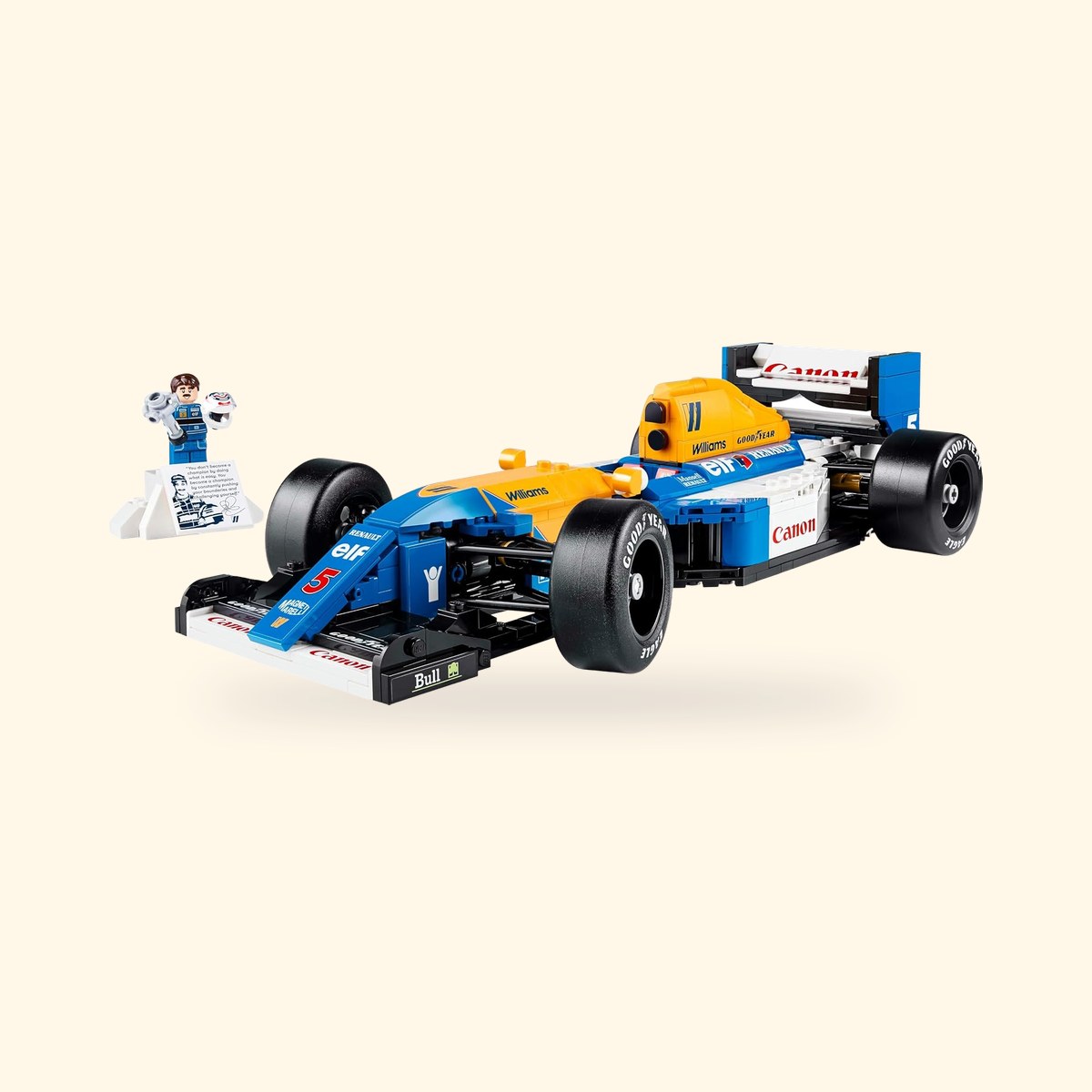 LEGO Icons Williams FW14B 10353 et minifigurine de Nigel Mansell sur son podium, sur fond crème