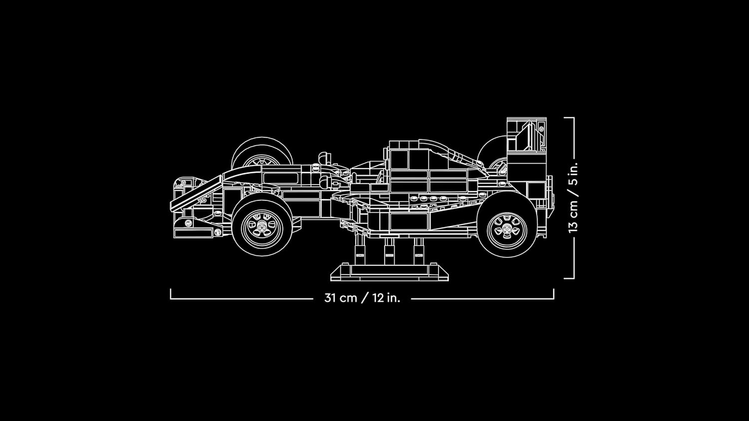 Schéma des dimensions de la Williams sur son présentoir : 31 cm de long, 13 cm de haut
