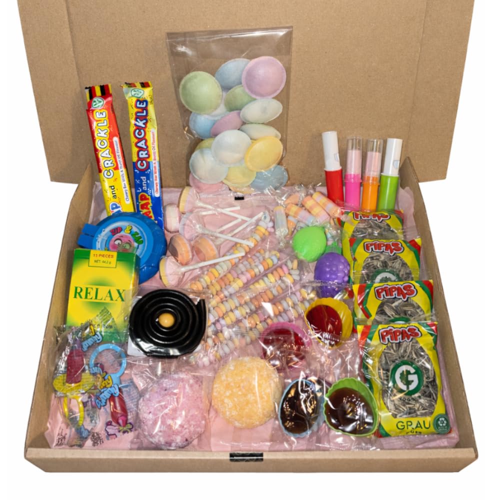 Box ouverte vue de face : soucoupes, Snap and Crackle, sucettes, colliers, roudoudous, pipas et boules coco