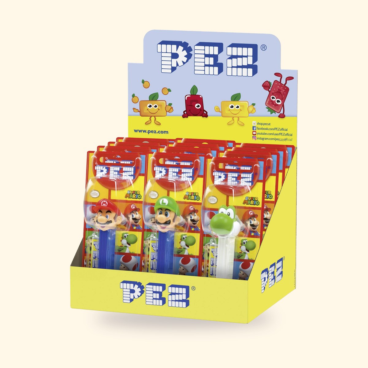 Présentoir PEZ de 12 blisters Super Mario, distributeurs Mario, Luigi et Yoshi en façade, sur fond crème