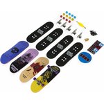 Contenu dun pack Zero étalé : planches, grips, trucks, roues, visserie, outil et autocollants