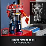 Optimus Prime en robot sur un bureau, avec le schéma de ses dimensions : 35 cm de haut