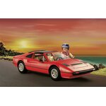 Ferrari 308 GTS Playmobil et Thomas Magnum sur une route de bord de mer au coucher du soleil