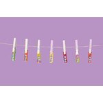 Visuel publicitaire : recharges PEZ de plusieurs parfums accrochées à une corde à linge