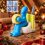 Dérouleur de scotch rigolo posé sur un bureau en bois dans un grenier de Noël