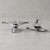 Paire de trucks de skate en aluminium brut, gommes noires