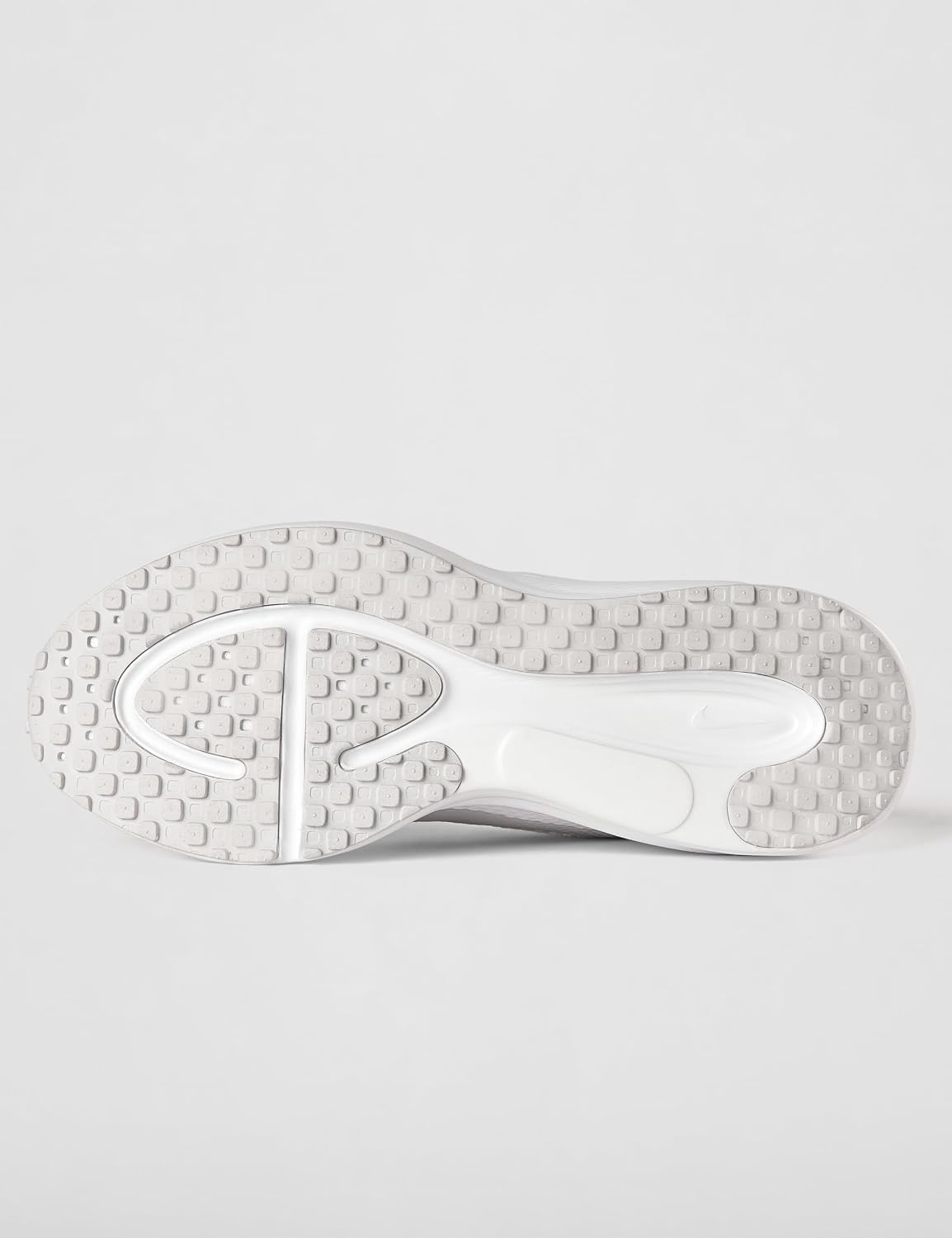 Suola bianca e grigia con intagli di flessione della Nike Revolution 8