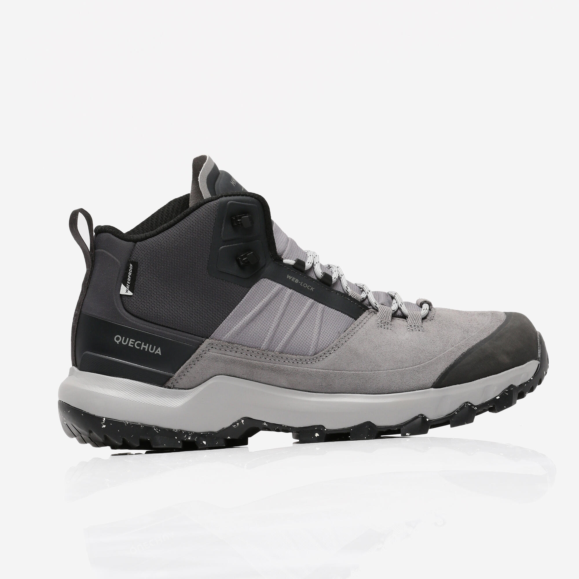 Scarpa da trekking Quechua MH500 Mid grigia vista di profilo con la linguetta sul tallone