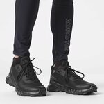Salomon Alphacross 5 nere indossate con calze nere