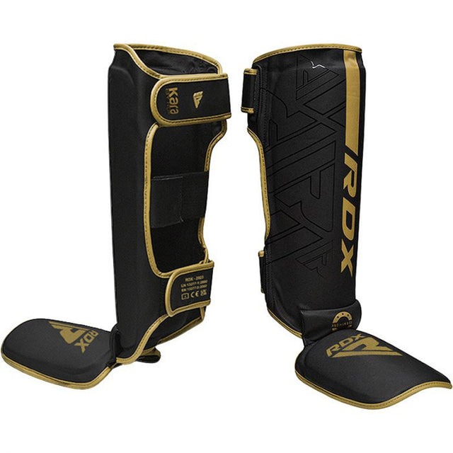protege-tibias-boxe-f6-kara-rdx-noir-or