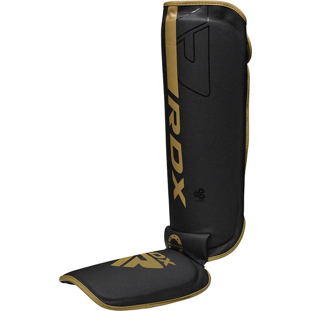 protege-tibia-de-boxe-f6-kara-rdx-noir-or