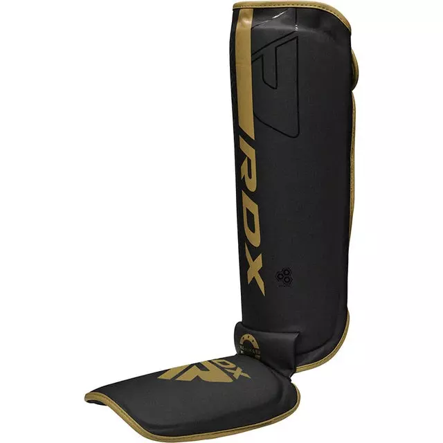 protege-tibia-de-boxe-f6-kara-rdx-noir-or