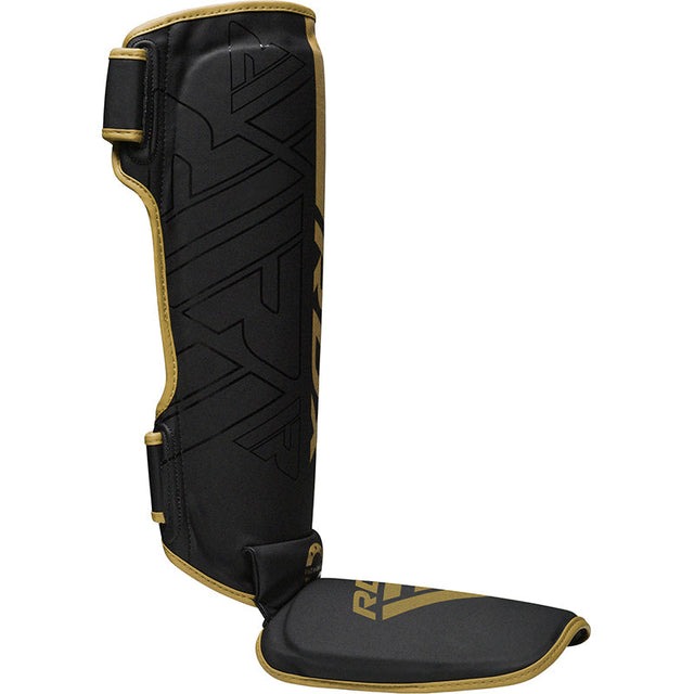 protege-tibias-de-boxe-kara-rdx-noir-or