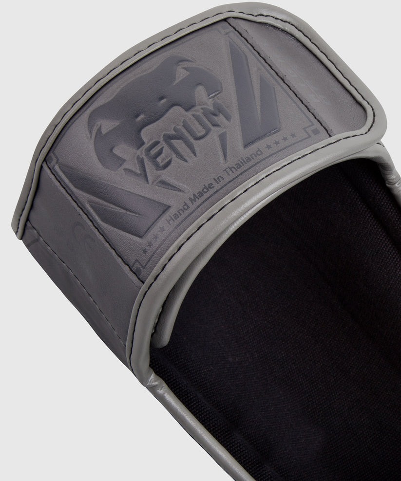 protege-tibias-elite-venum-gris