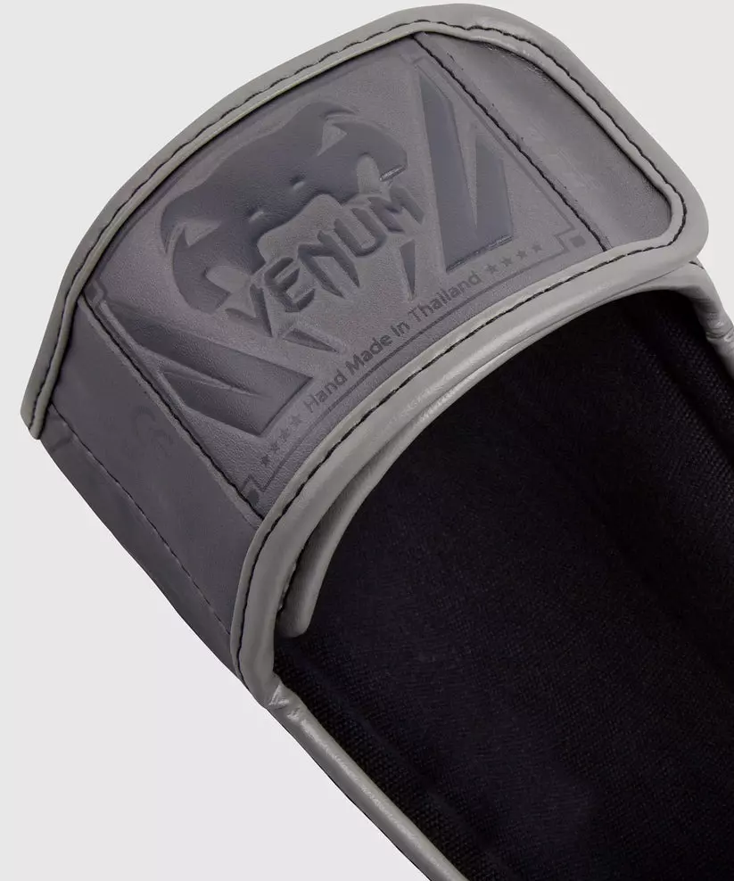 protege-tibias-elite-venum-gris