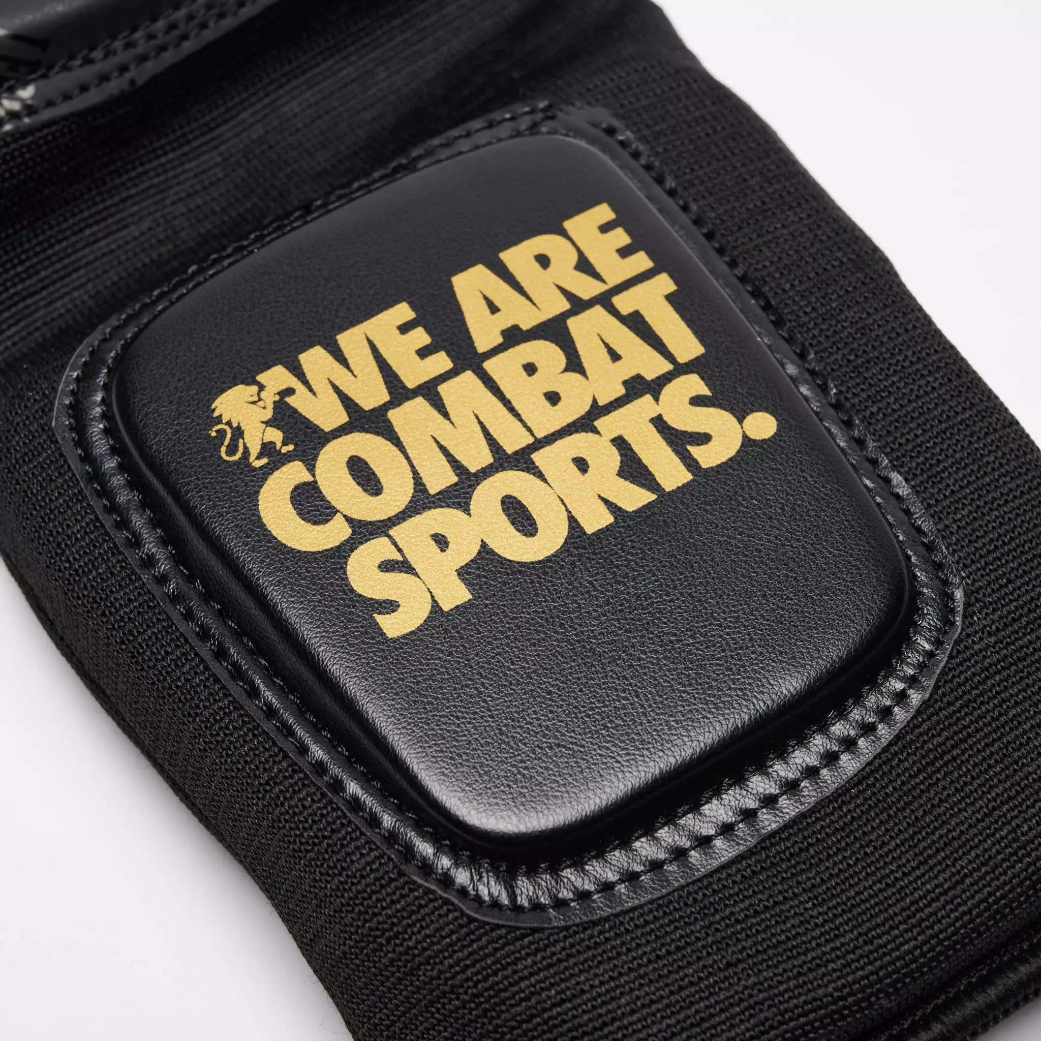 protege-tibias-boxe-leone-dna-noir