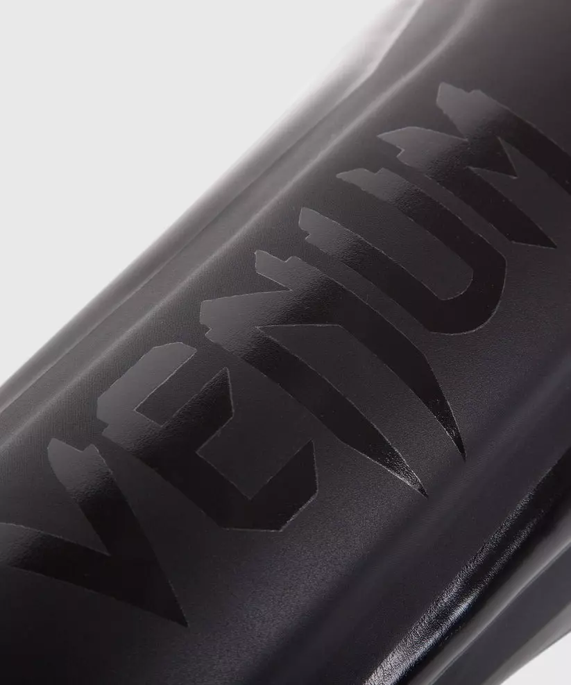 protege-tibias-boxe-venum-elite-noir