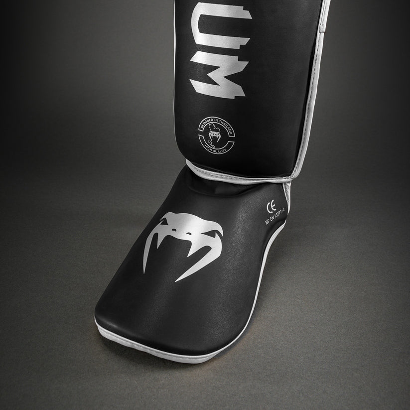 protege-tibia-venum-challenger-noir-argent-venum