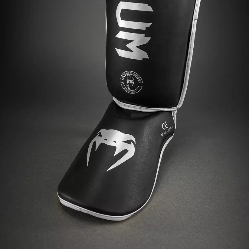protege-tibia-venum-challenger-noir-argent-venum