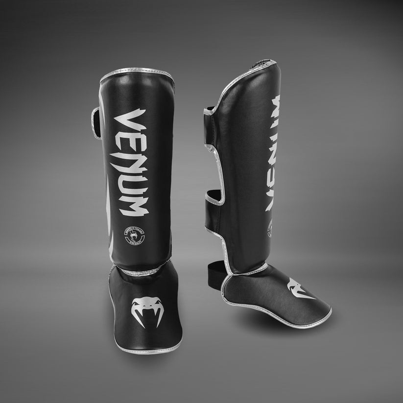 protege-tibias-venum-challenger-noir-argent