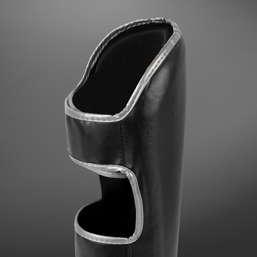 protege-tibias-venum-chalenger-noir-argent