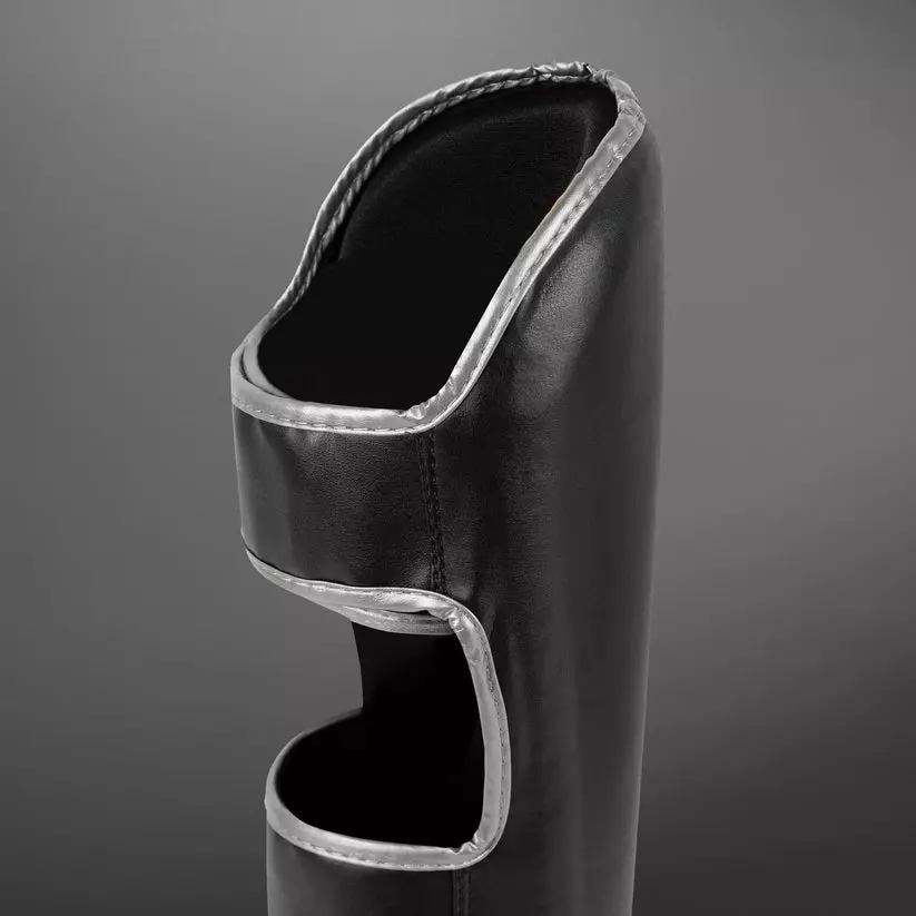 protege-tibias-venum-chalenger-noir-argent
