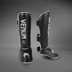protege-tibias-venum-challenger-noir-argent