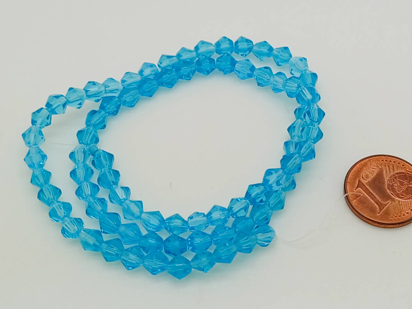 perles verre toupie facette 4mm bleue en fil