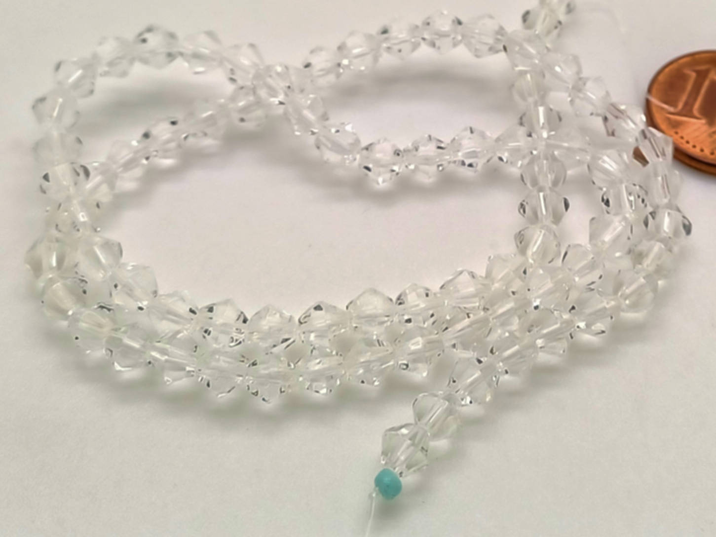 perles verre toupie facette 4mm transparent en fil